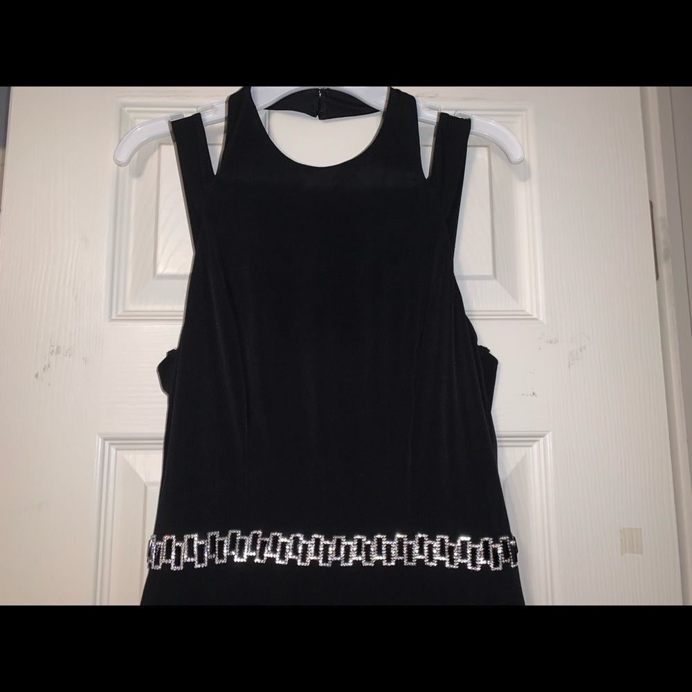 Black Mid-length dress with beaded waist band.